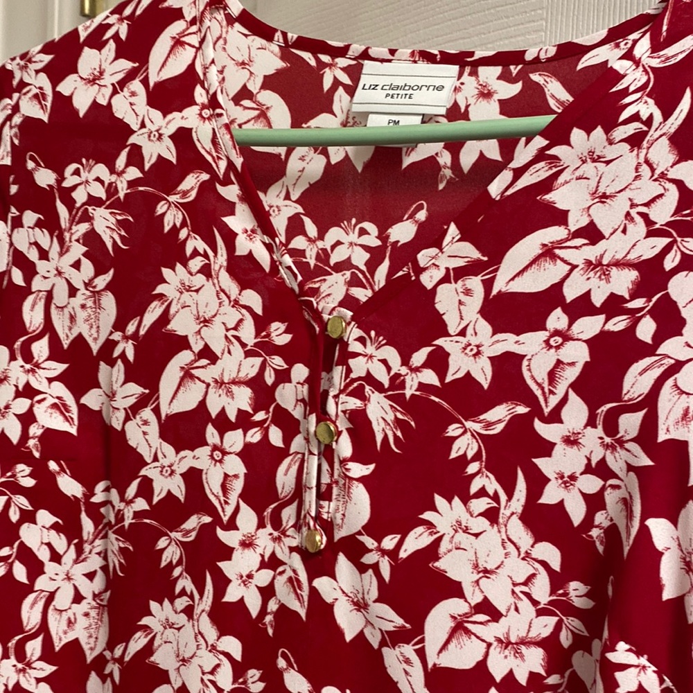 Red blouse with white flowers